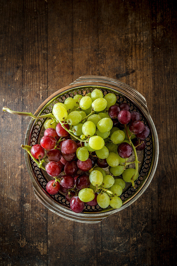 Bunch of Red and Green Grapes in a metal platter