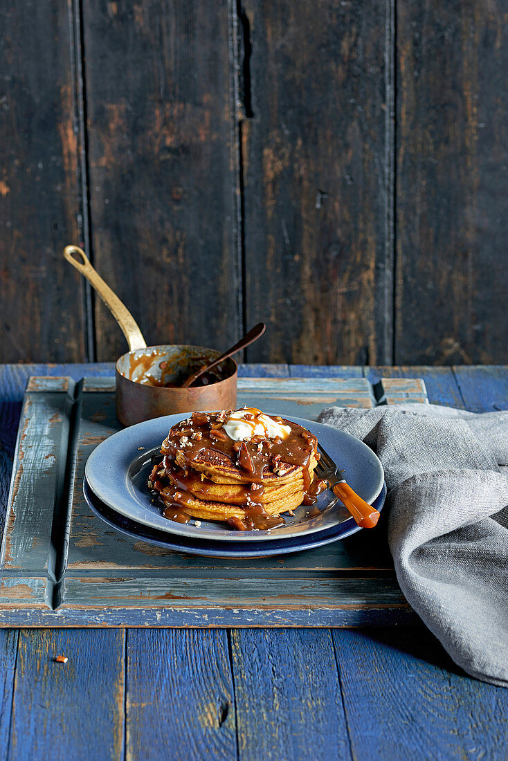 Pumpkin pancake stack with walnut and toffee sauce