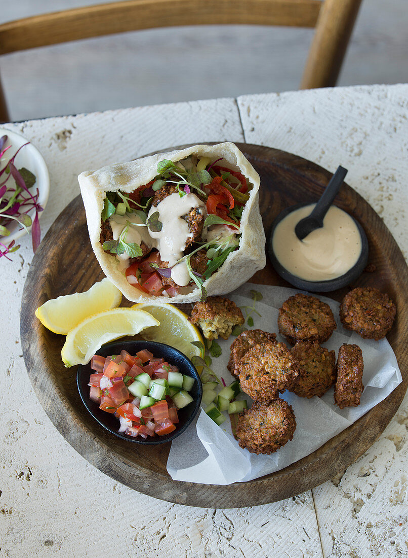 Falafel with pita bread, salsa and dips