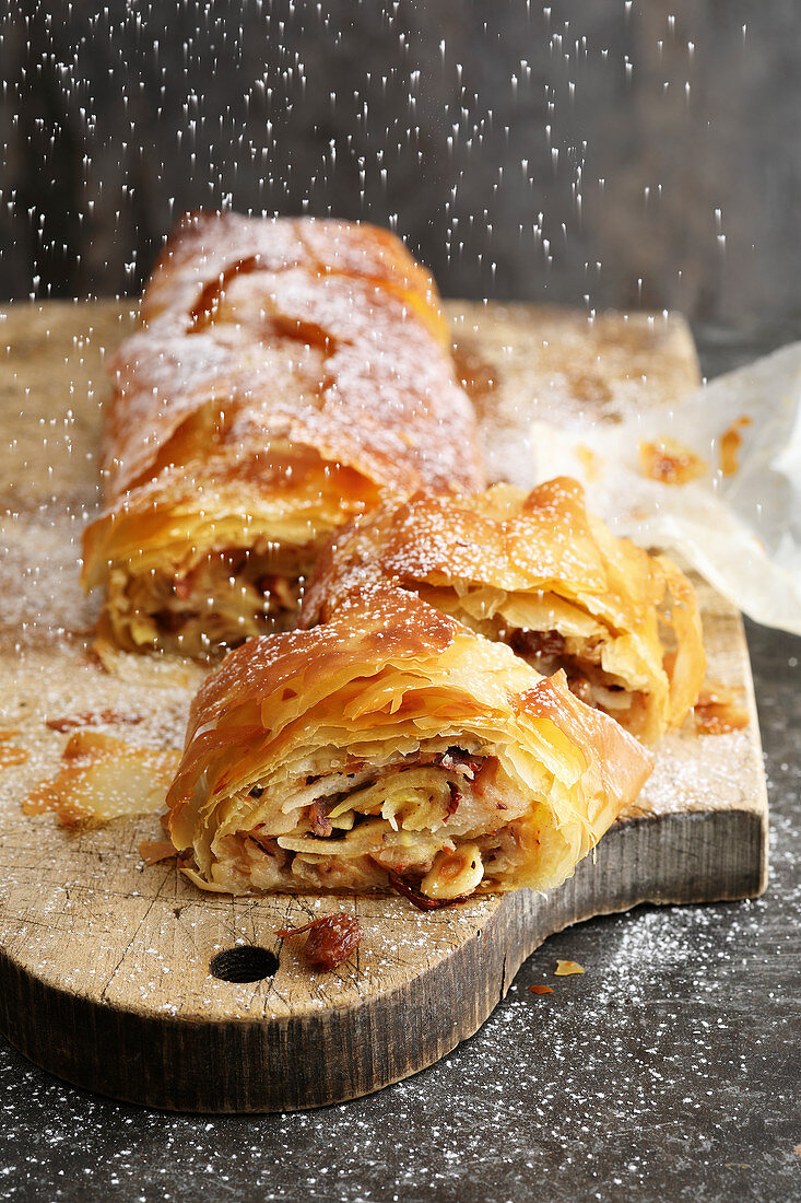 Apple and pear strudel with nuts and raisins