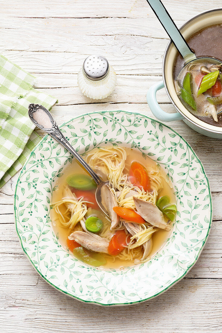 Chicken broth with angel's hair pasta and vegetables