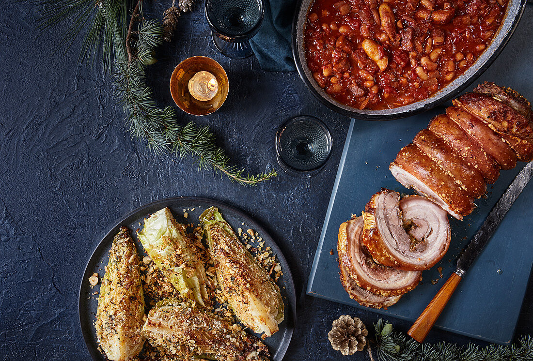Festive porcetta, one-pan pigs-in-blanket beans and roasted hispi cabbage with garlic and chilli crumb