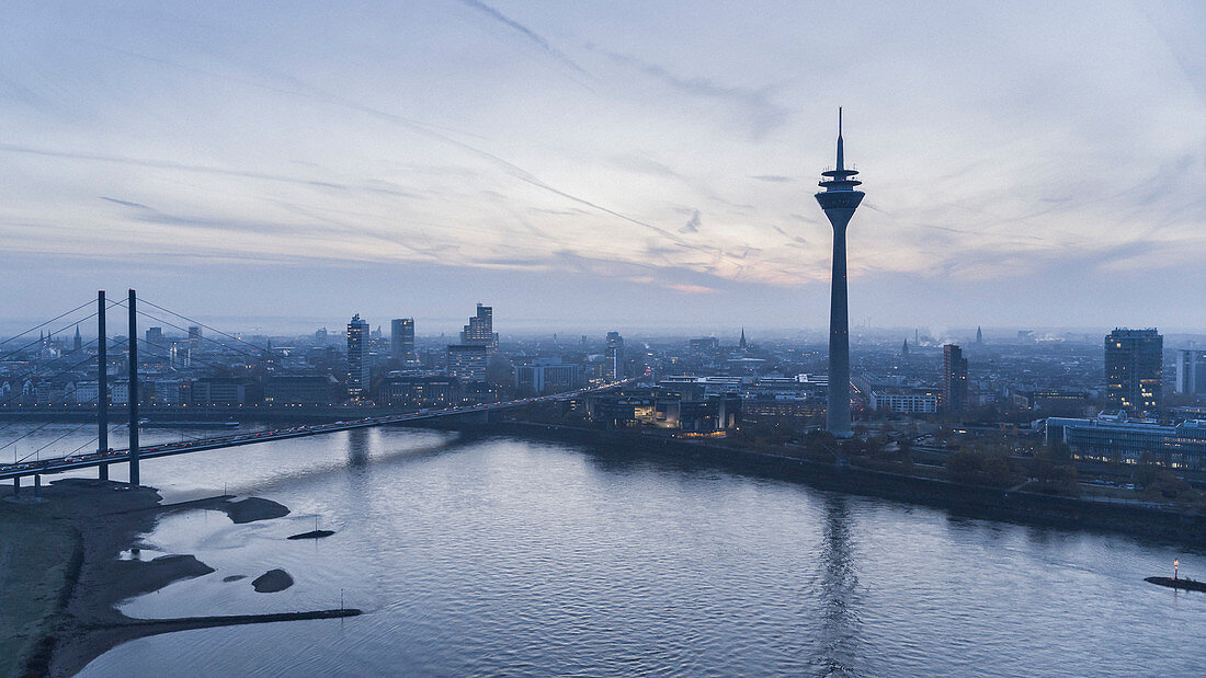 Rhine Tower and Rhine River at dusk, Duesseldorf, North Rhine-Westphalia, Germany