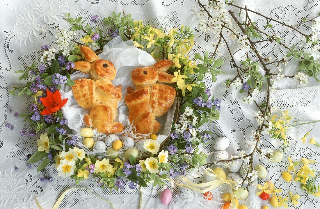 Baked Easter bunny & Easter eggs in spring flower wreath