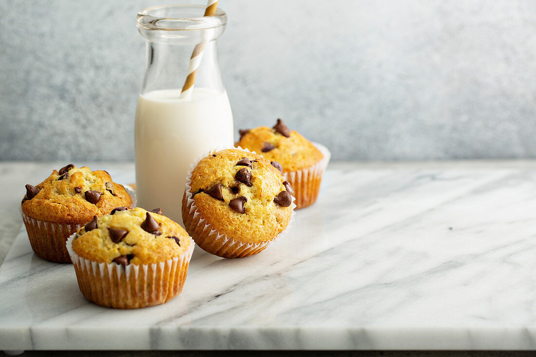 Chocolate chip muffins with a bottle of milk