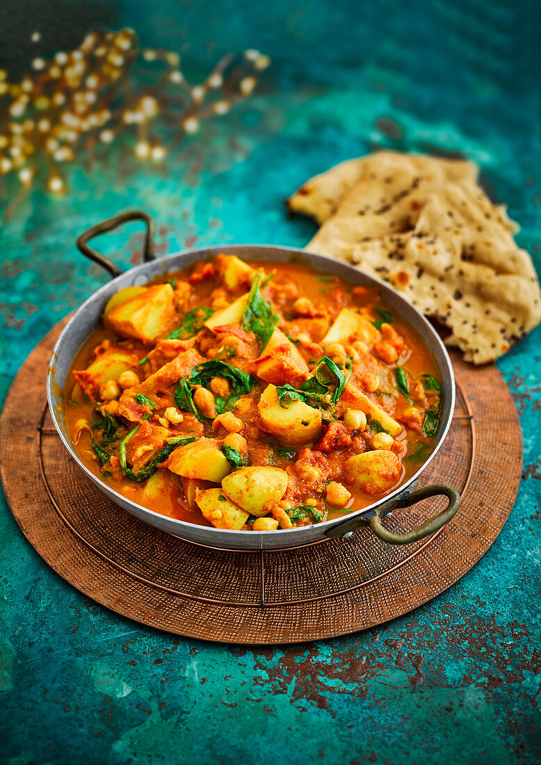 Indian-style potato curry with chickpeas and spinach