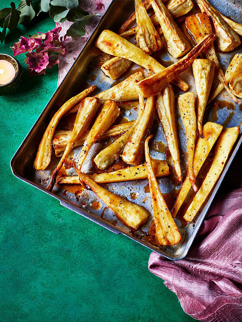 Oven-baked whiskey parsnips