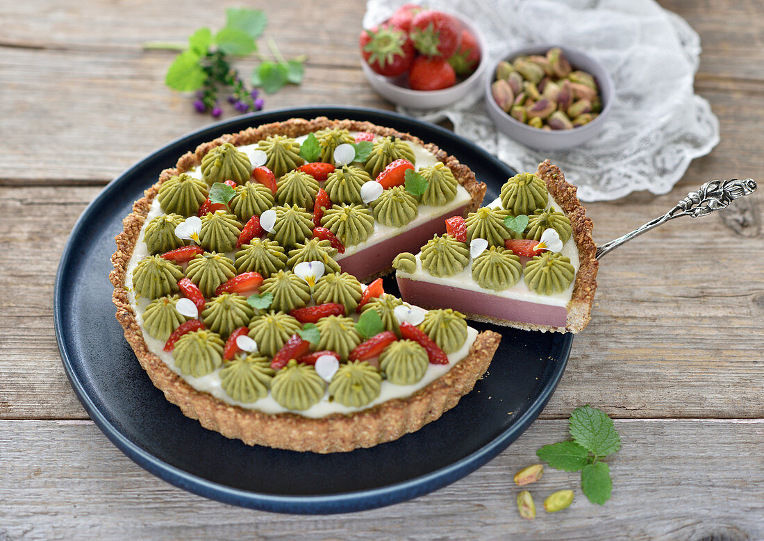 Vegan berry and coconut tart with berry and pistachio cream