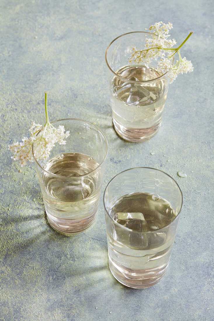 Glasses of elderflower syrup
