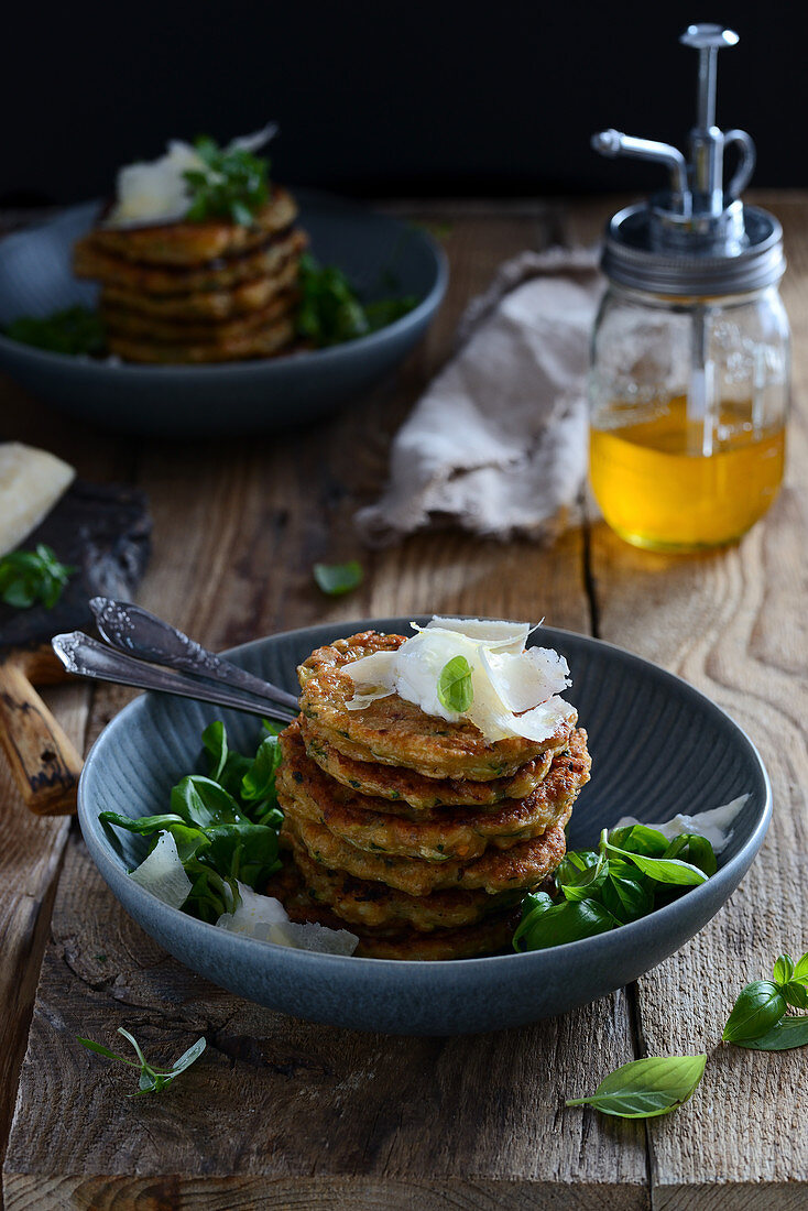 Pancakes with spinach and ricotta served with parmesan and lamb's lettuce