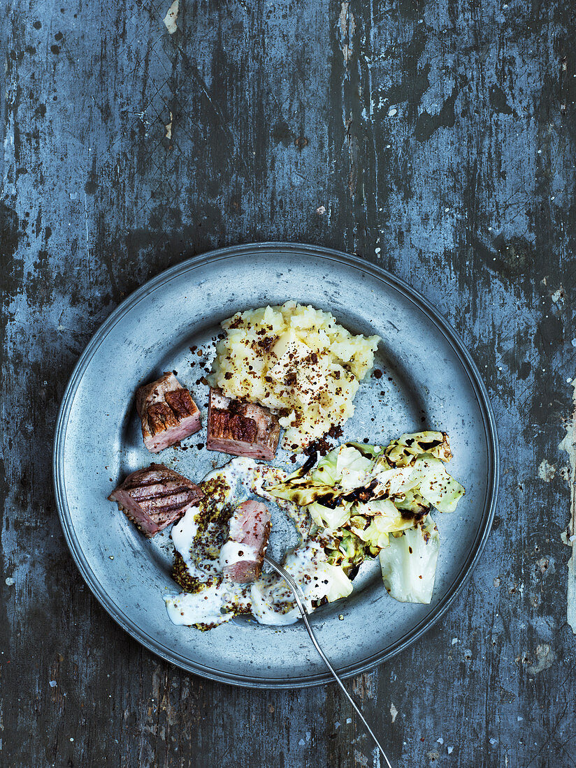 Grilled duck breast with celery purée and roasted cabbage