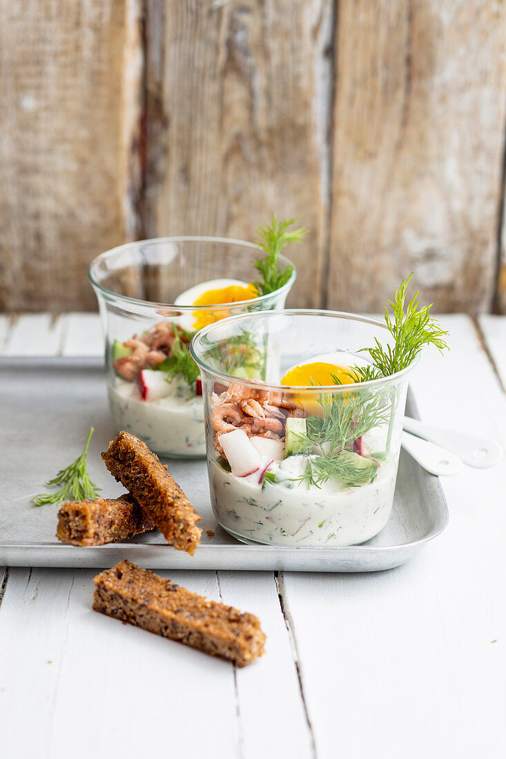 Shrimp and egg salad in glasses