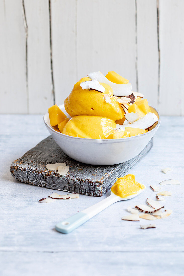 Mango and coconut ice cream with coconut chips