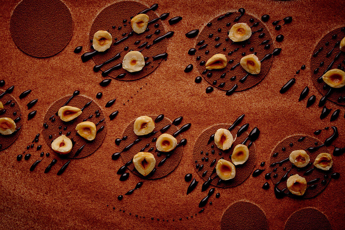 Chocolate still life with hazelnuts and dark chocolate drops