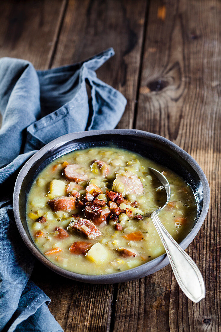 Hearty pea soup with sausages and bacon