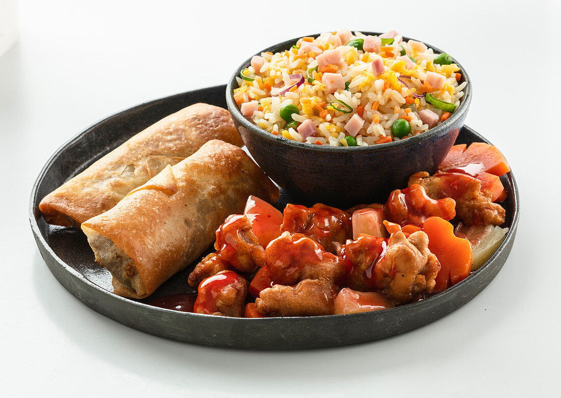 Chaw fan in a bowl with sweet chicken and chinese rolls