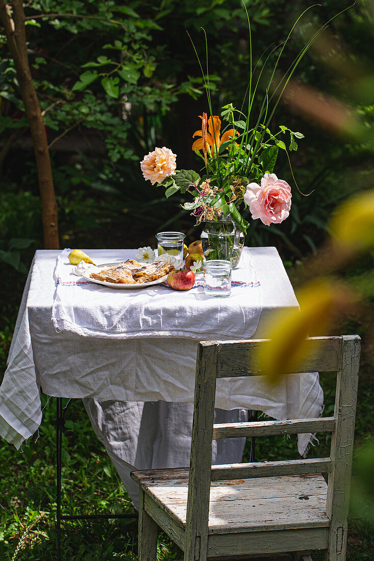 Table in the garden with flowers