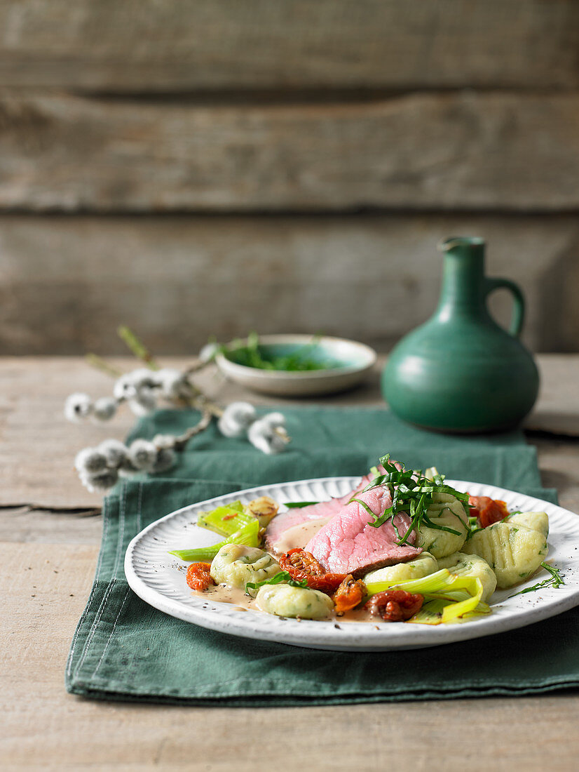 Braised veal with wild garlic and quark gnocchi