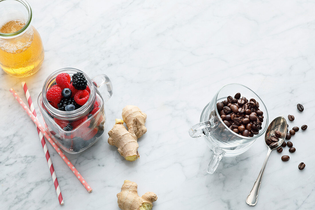 Lemonade, paper straws, mixed berries, ginger and coffee beans