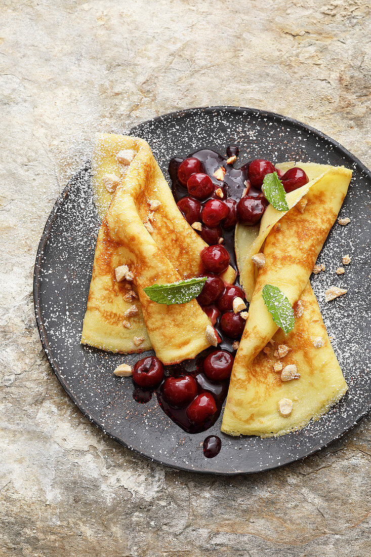 Pancakes with sour cherries and caramelised almonds