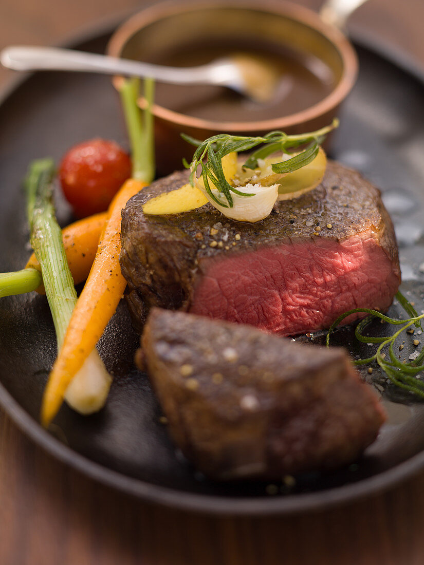 Seared beef steak with glazed vegetables