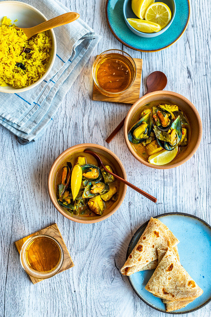Seafood Curry with wholewheat rotis, turmeric rice and beer