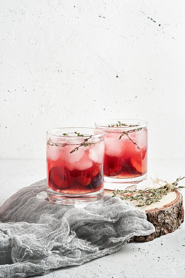 Plum lemonade with ice and thyme