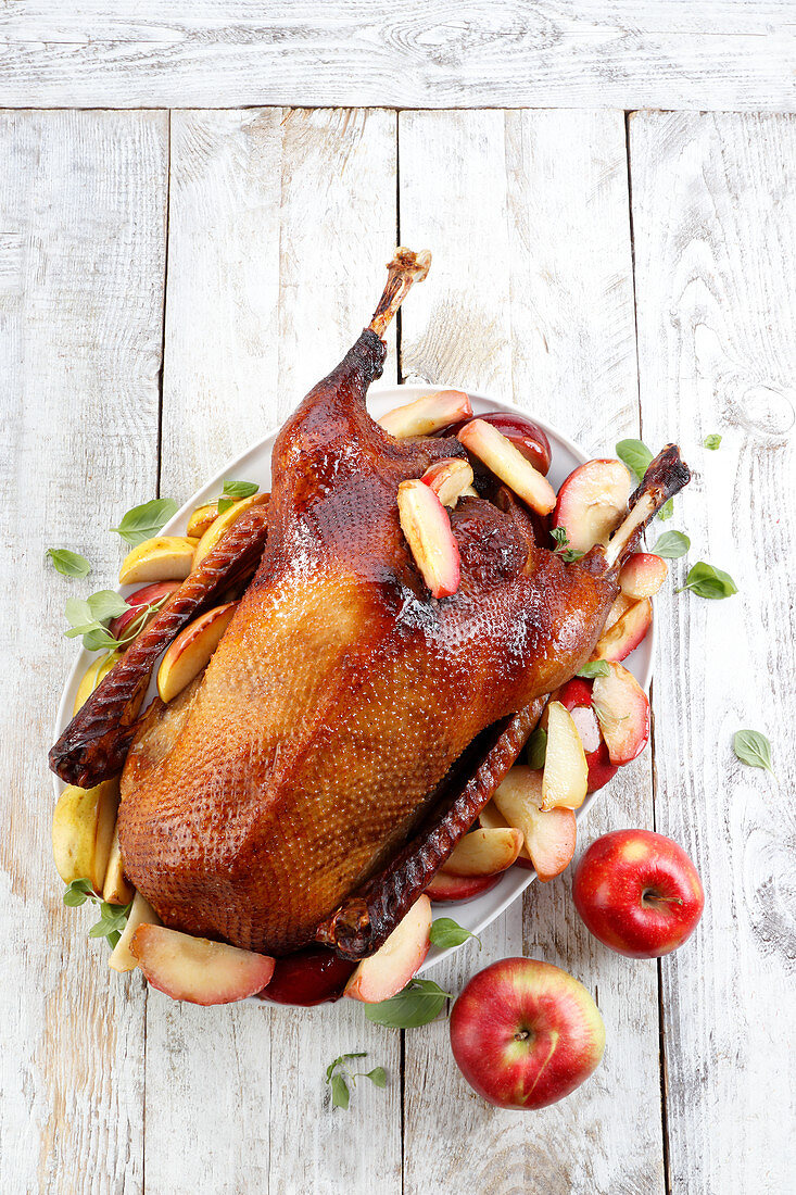 Whole baked goose with apples