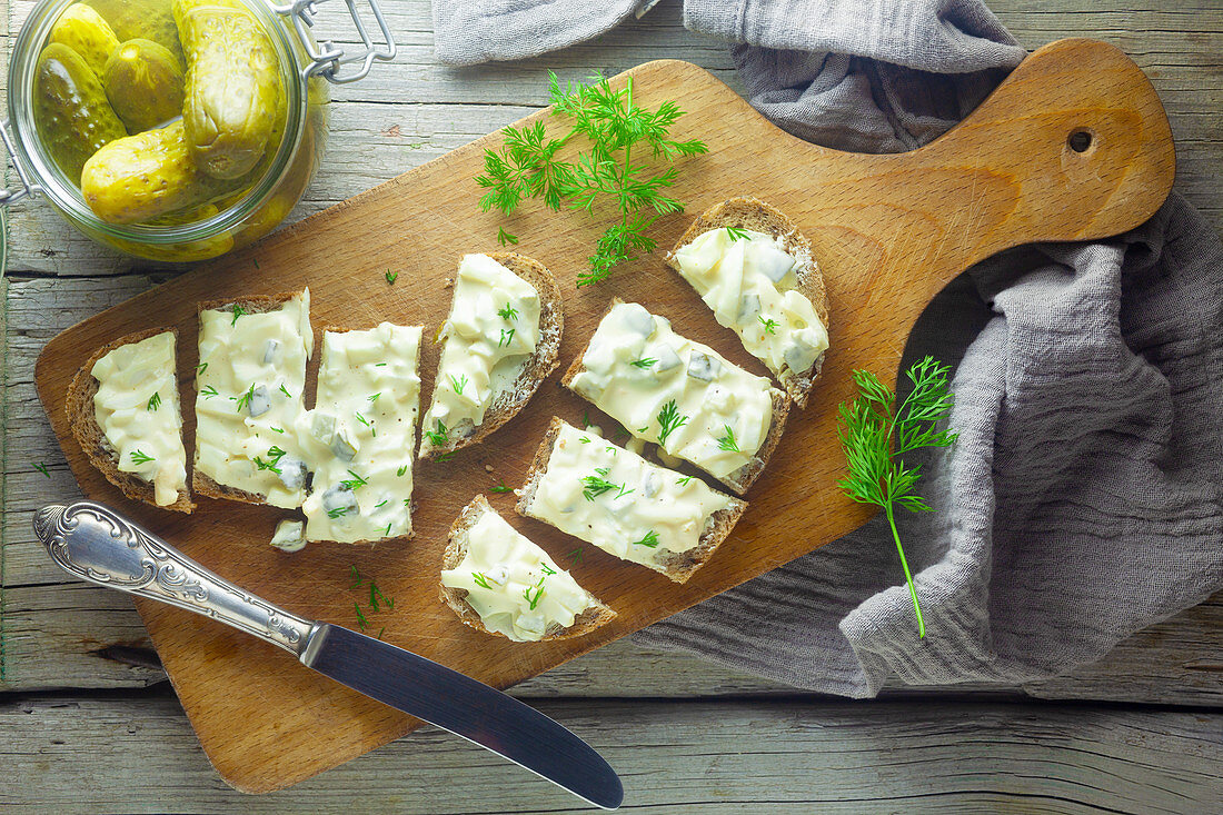 Bread with egg salad and gherkins