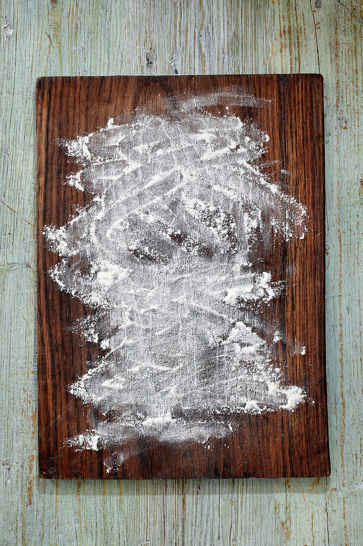 Flour on a wooden board