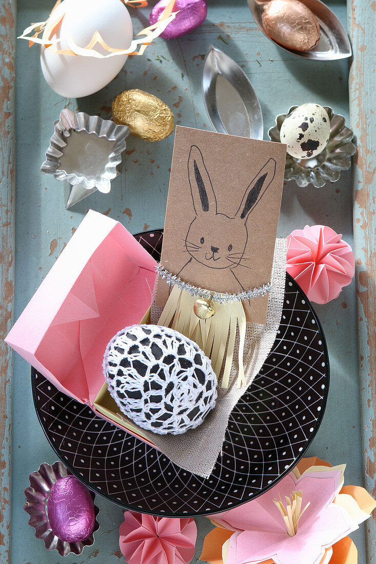 Easter bunny in fringed dress on greetings card and decorations