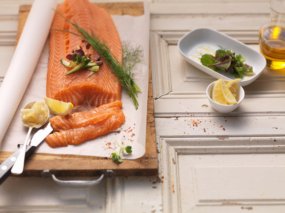 A side of salmon with herbs and lemon