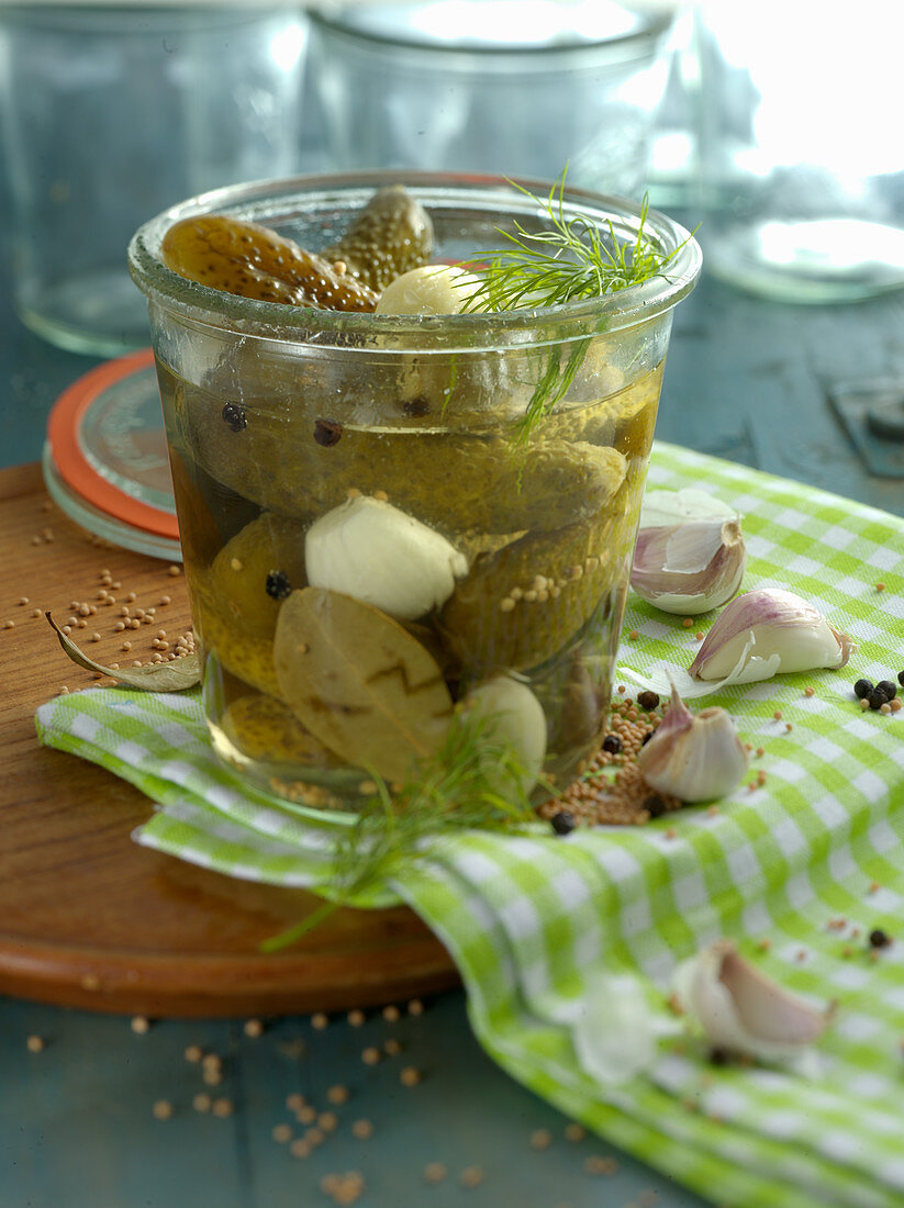 Gherkins and garlic in a preserving jar