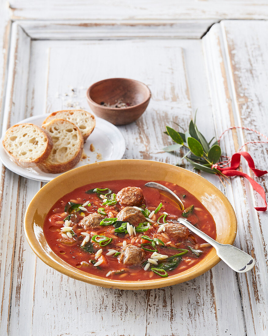 Italian tomato soup with orzo and meatballs