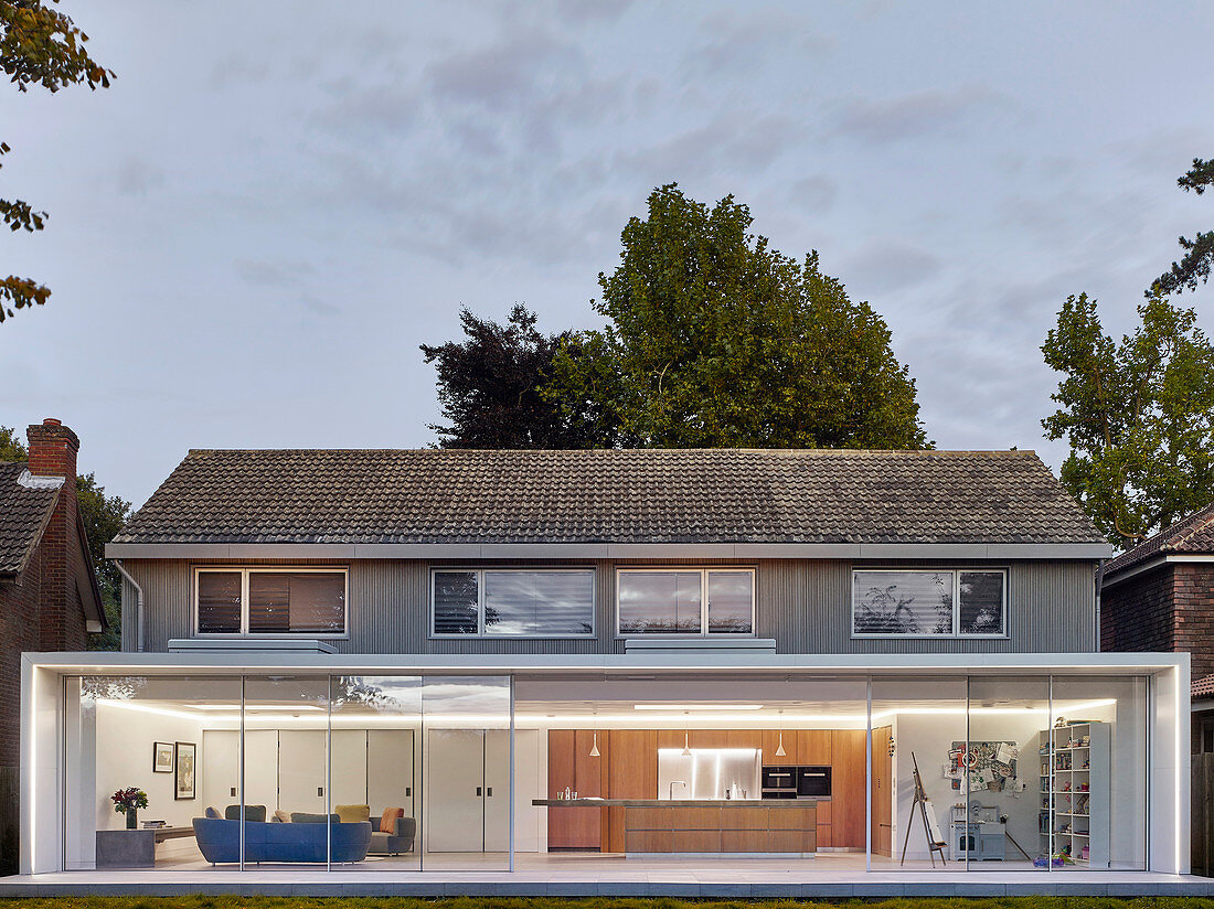 Exterior view of house with modern glass extension