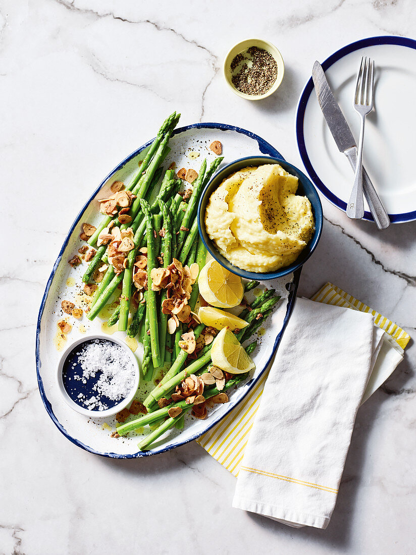 Lemony mashed potatoes with green asparagus, almonds and mint