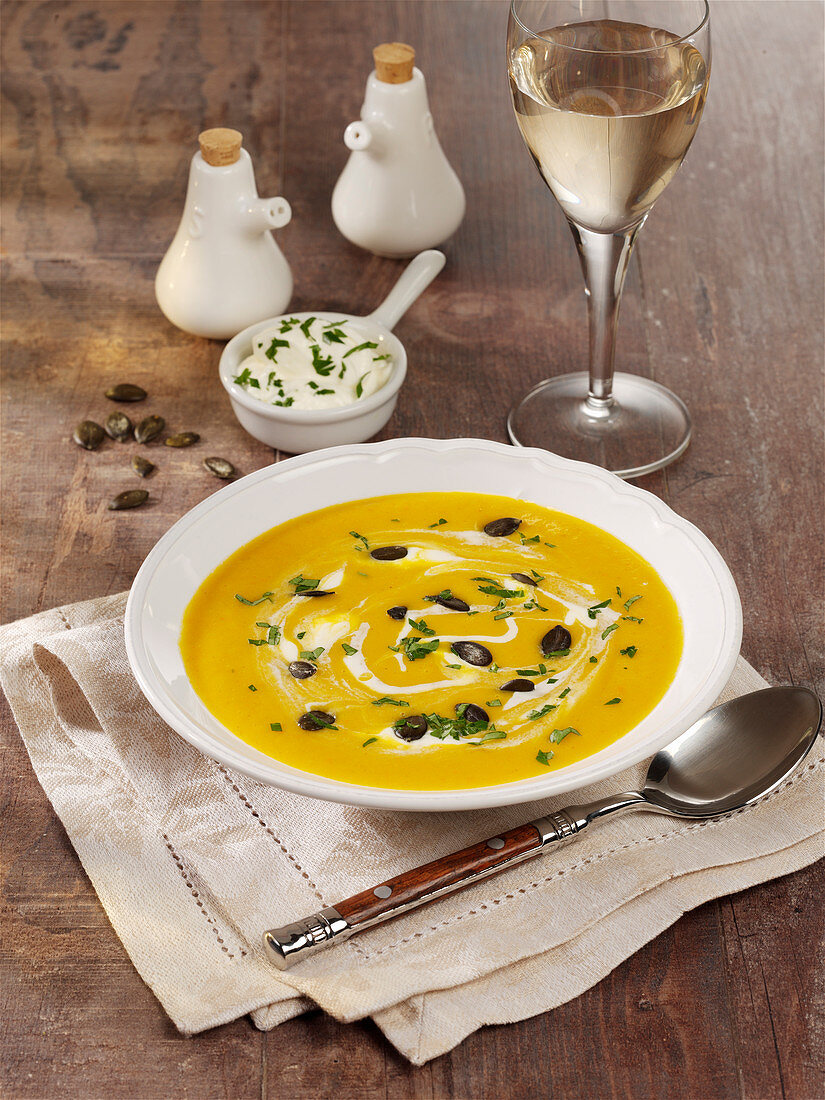 Butternut squash soup with apple and processed cheese