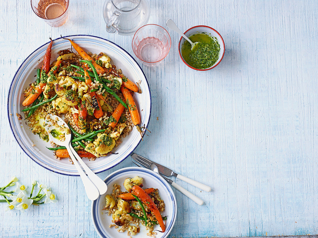 Roasted new carrots, cauliflower, grains and carrot-top dressing