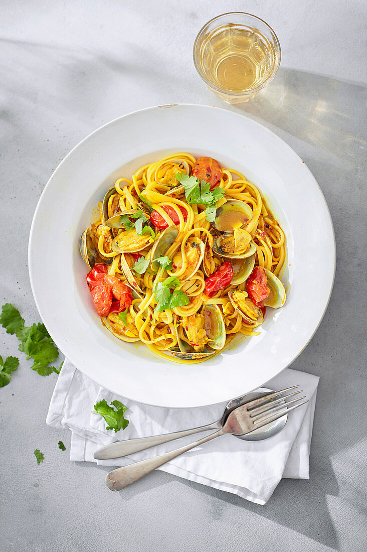Linguine with clams, turmeric and coriander