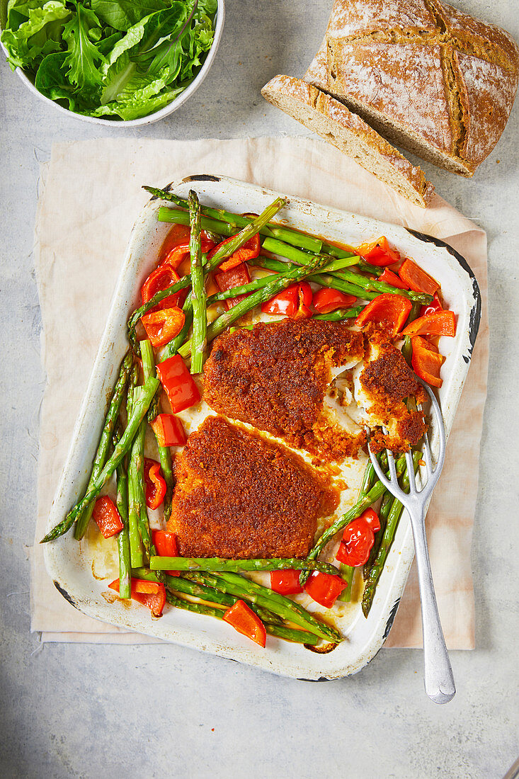 Roast haddock with chorizo crust, asparagus and peppers