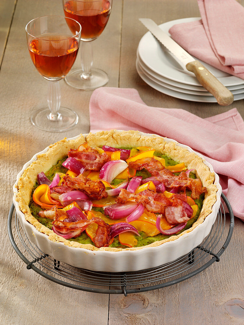 Colorful quiche with Hokkaido, bacon and red onions