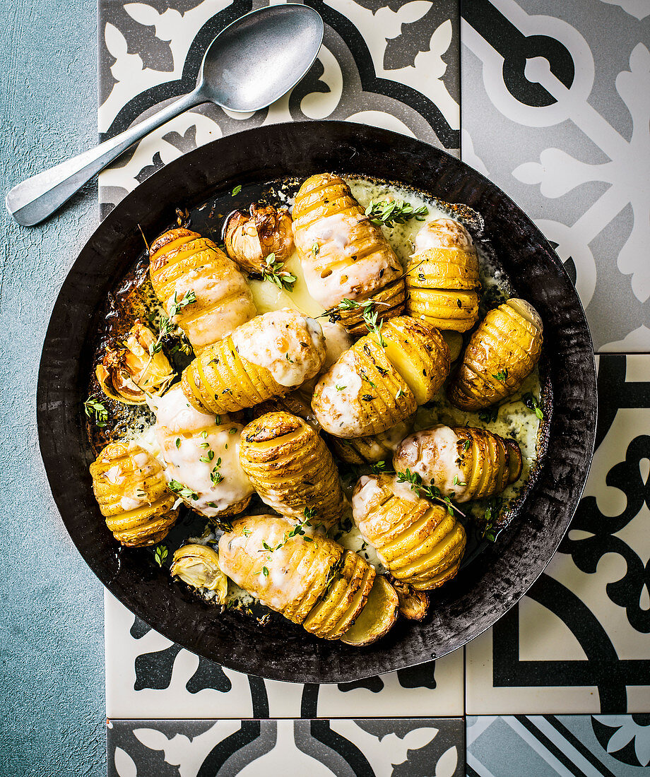 Hasselback roasties with taleggio and thyme