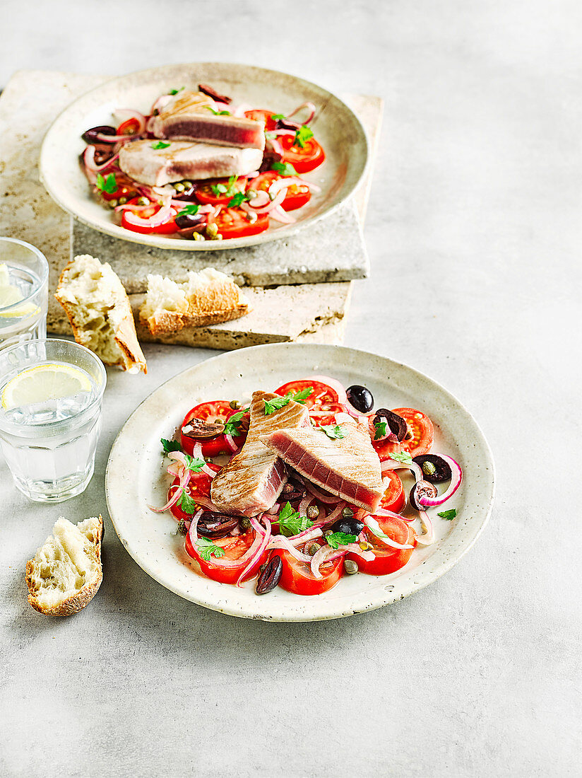 Tuna with marinated tomato and olive salad
