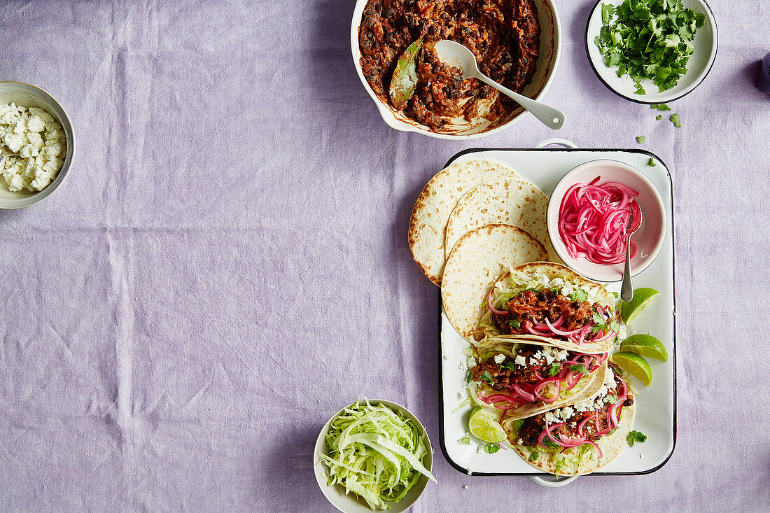 Smokey pulled aubergine and black bean tacos