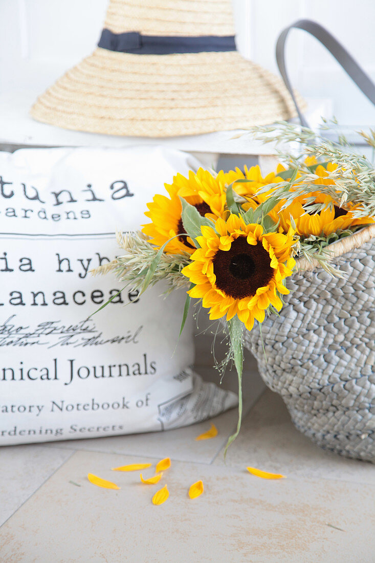 Sunflowers and grasses in shopping bag