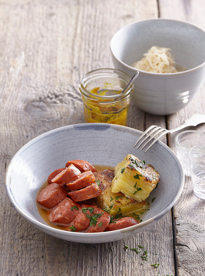 Marinated sausages with potato gratin