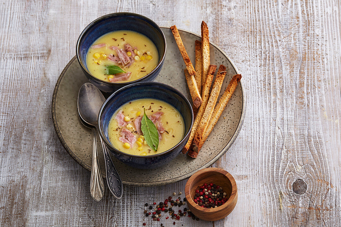 Pea soup with smoked meat and corn