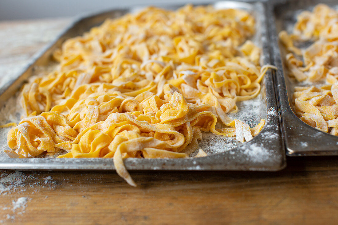 Fresh pasta on oven trays