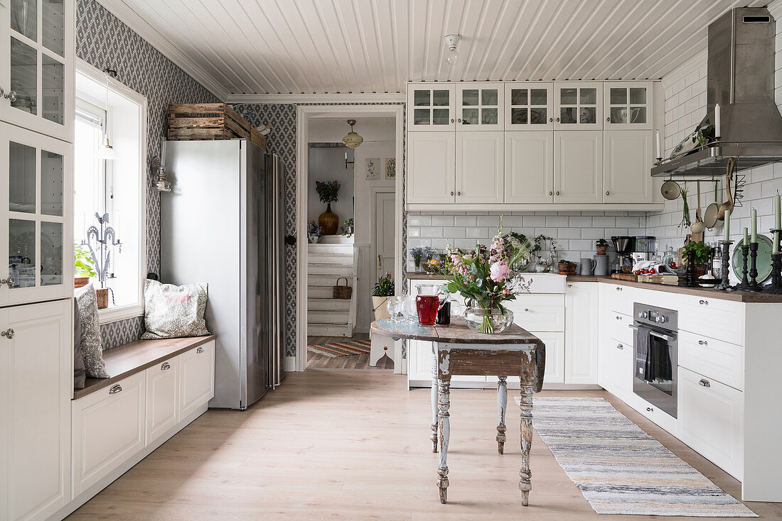 Antique drop-leaf table in classic, country-house-style kitchen