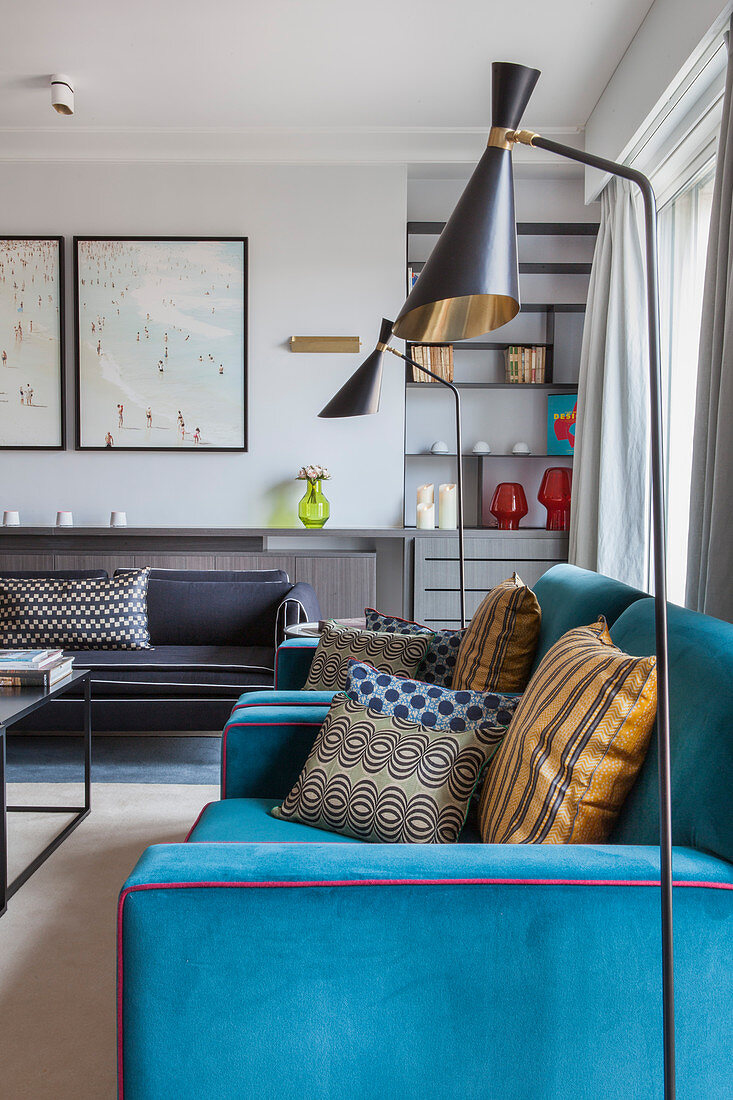 Blue custom sofa and standard lamp in living room
